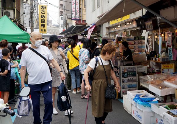 Shoppers walk in front of Tsukiji's whale meat restaurant in Tokyo, Japan on July 2, 2019. (Karyn Nishimura/AFP/Getty Images)