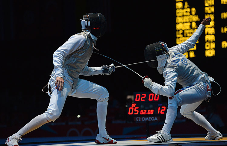 Race Imboden of the United States (L) fences against Italy's Andrea Baldini during their Men's foil bout at the London 2012 Olympic games. (Alberto Pizzoli/AFP/GettyImages)