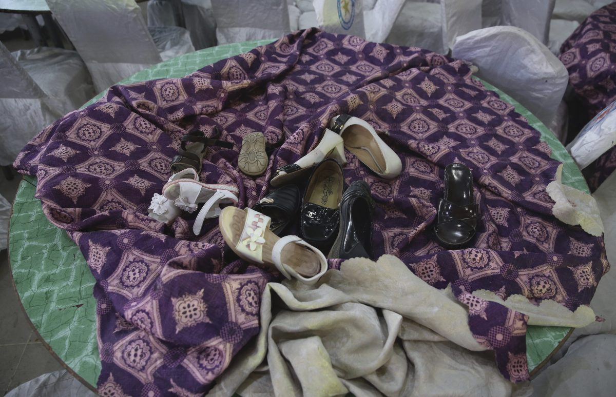 Shoes are seen on the table at the damaged Dubai City wedding hall after an explosion in Kabul, Afghanistan, on Aug. 18, 2019. (Rafiq Maqbool/AP Photo)