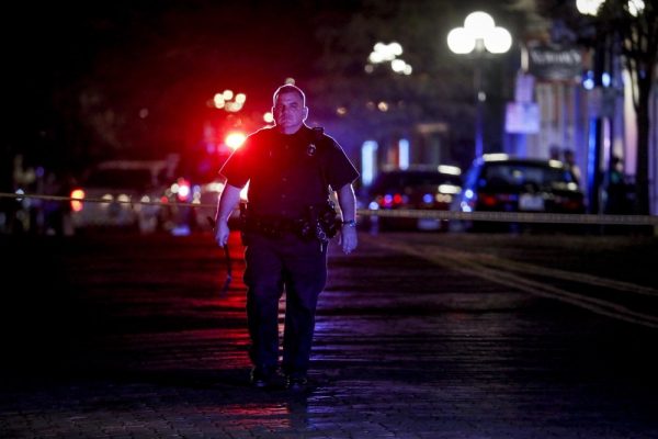 Authorities work at the scene of a mass shooting, Sunday, Aug. 4, 2019, in Dayton, Ohio. Several people in Ohio have been killed in the second mass shooting in the U.S. in less than 24 hours, and the suspected shooter is also deceased, police said. (AP Photo/John Minchillo)