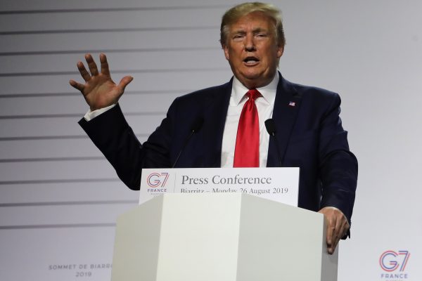 President Donald Trump gestures during a joint-press conference with French President Emmanuel Macron in Biarritz, south-west France on Aug. 26, 2019. (Ludovic Marin/AFP/Getty Images)
