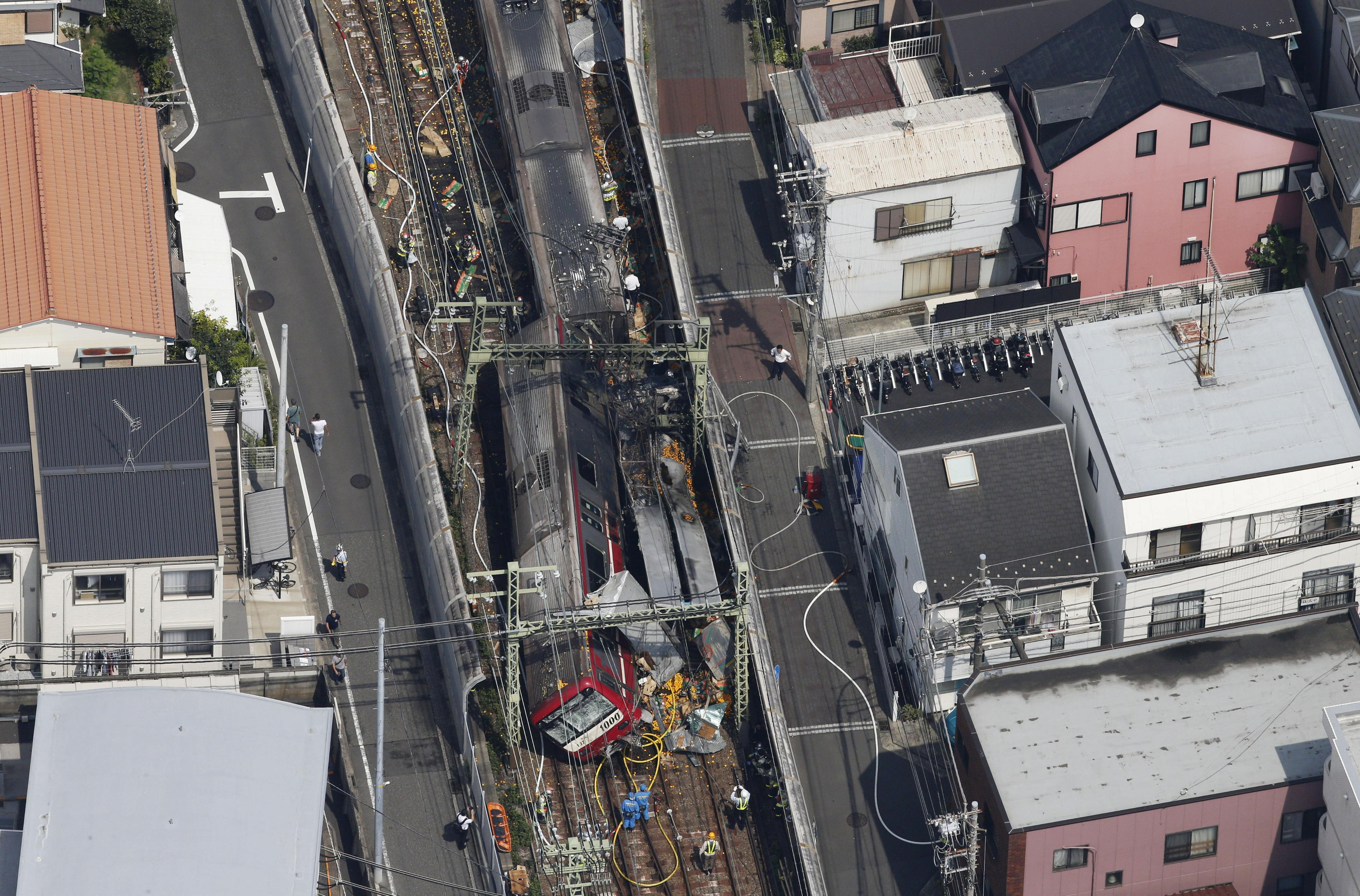 A train is seen as it is derailed after a collision with a truck in Yokohama, near Tokyo, Japan on Sept. 5, 2019. (Kyodo/via Reuters)