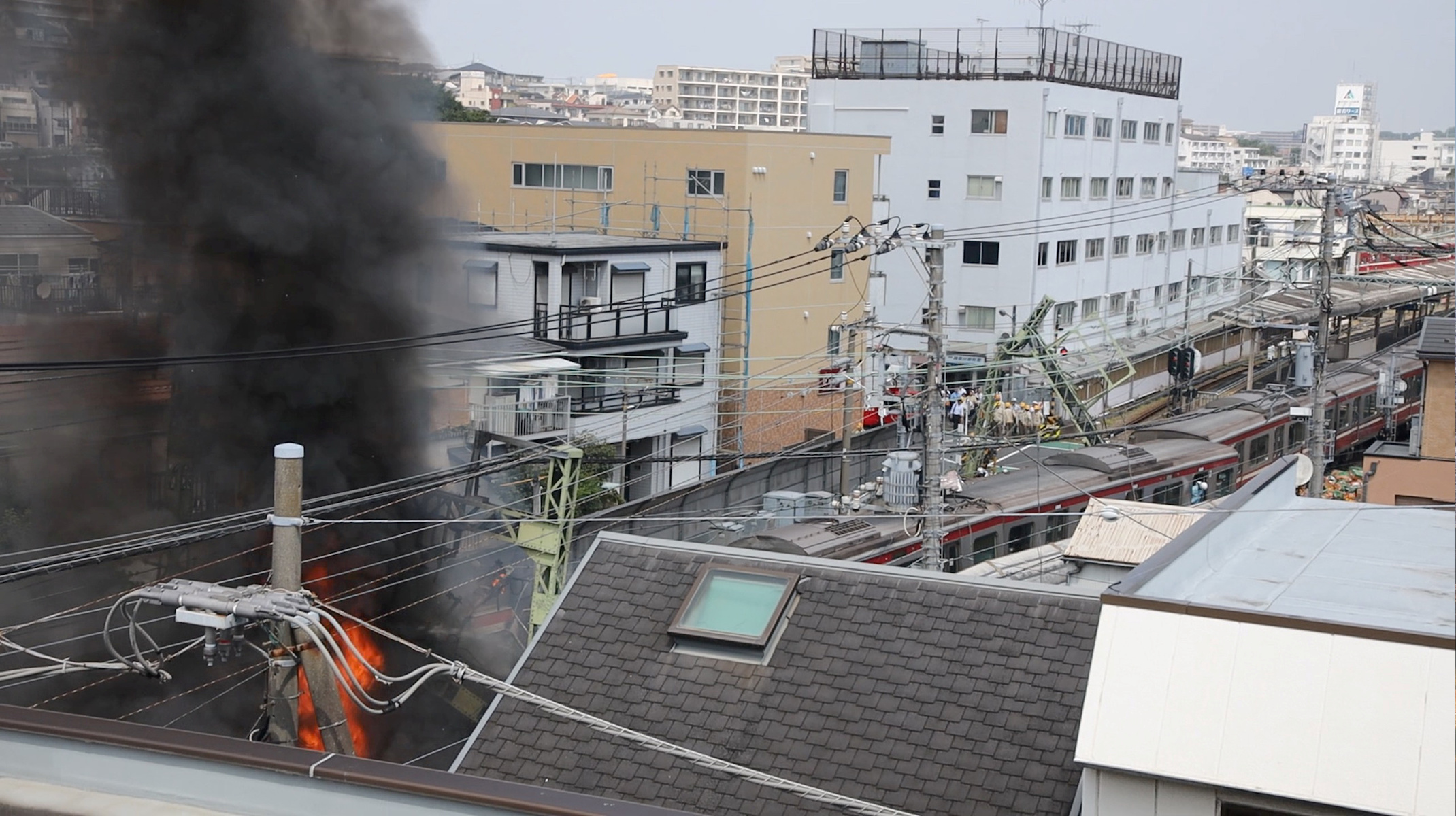 A view of fire and smoke at the site of a train derailment following a collision between an express train and a truck in Yokohama, Japan, Sept. 5, 2019. (Twitter/@tatsu_photo/via Reuters)