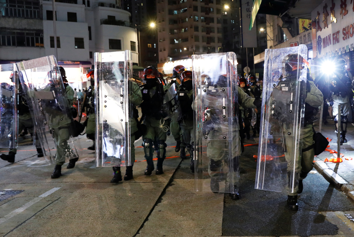 Riot police officers make their way along the street trying to disperse protesters gathering for a demonstration in Hong Kong, China on Oct. 21, 2019. (Kim Kyung-Hoon/Reuters)