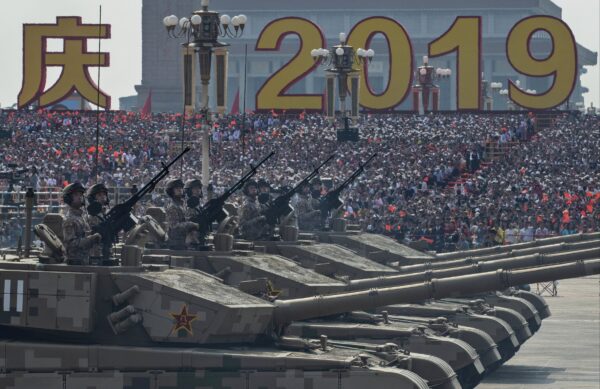 Chinese soldiers sit atop tanks as they drive in a parade to celebrate the 70th Anniversary of the founding of the People's Republic of China in 1949, at Tiananmen Square in Beijing, China on October 1, 2019. (Kevin Frayer/Getty Images)