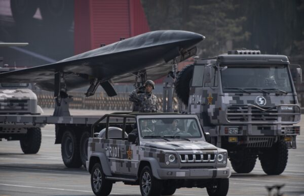 A Chinese soldier salutes in front of a drone during a parade to celebrate the 70th Anniversary of the founding of the People's Republic of China at Tiananmen Square in 1949 in Beijing, China on October 1, 2019. (Kevin Frayer/Getty Images)