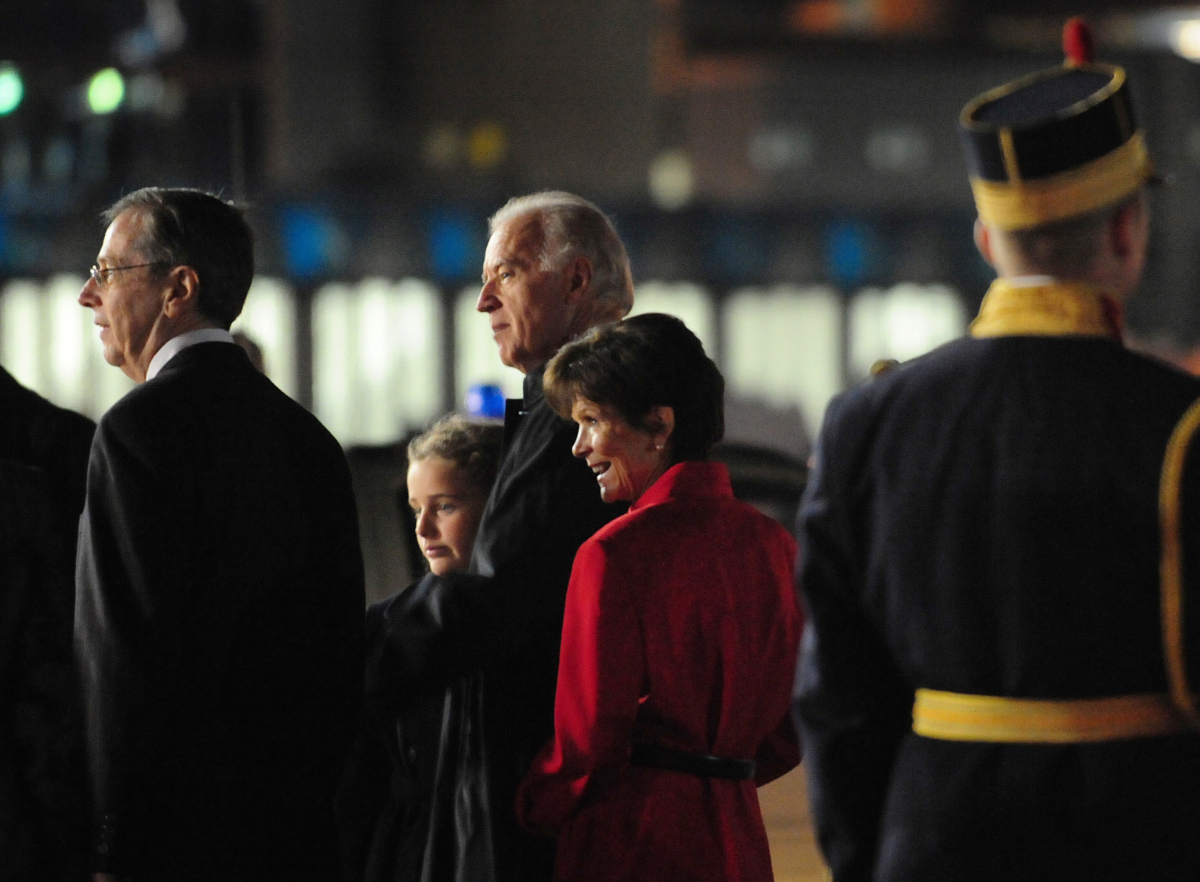 From Left to Right: Mark Gitenstein, former U.S. Ambassador to Romania, Finnegan James Biden, granddaughter of former Vice President Joe Biden, Joe Biden and Libby Gitenstein, wife of Mark Gitenstein arrive at the Henry Coanda International Airport in Bucharest on Oct. 21, 2009. (Daniel Mihailescue/AFP via Getty Images)