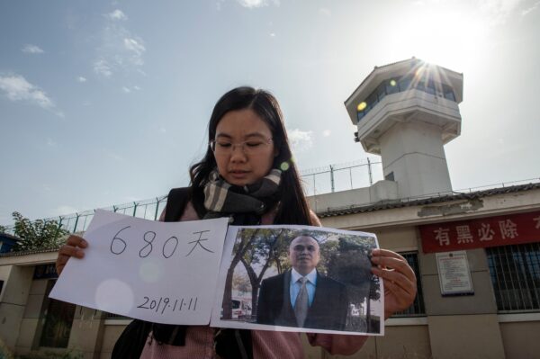 Xu Yan, wife of human rights lawyer Yu Wensheng, making a video for her husbands birthday in front of the Xuzhou City Detention Centre This picture taken on Oct. 30, 2019. Yu's birthday on Nov. 11 will mark his 680th days under detention in Xuzhou. (Nicolas Asfouri/AFP via Getty Images)