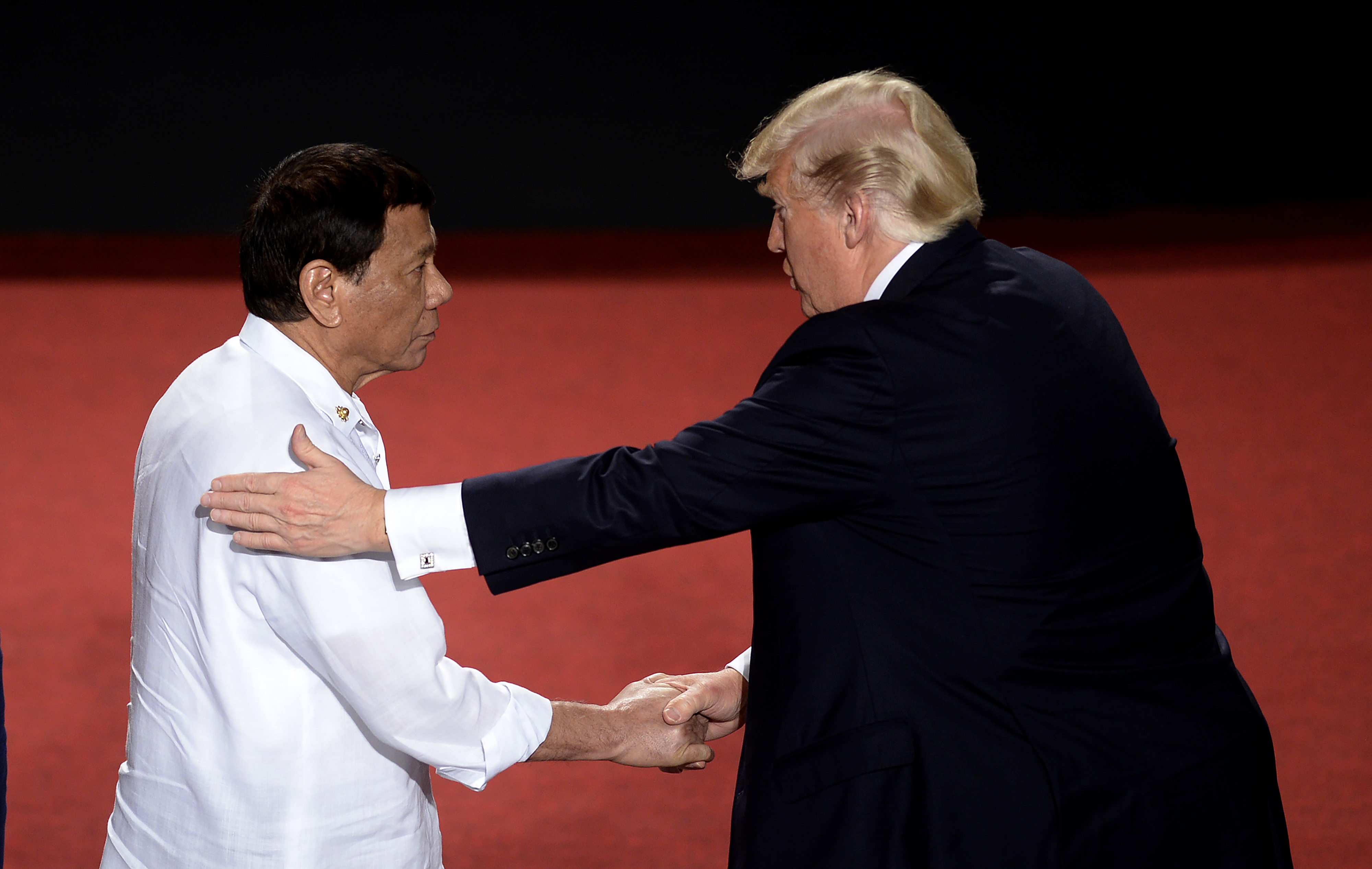 Philippine President Rodrigo Duterte shakes hands with U.S. President Donald Trump (R) during the 31st ASEAN Summit in Cultural Center of the Philippines in Manila, Philippines, on Nov.13, 2017. (Noel Celis/AFP via Getty Images)