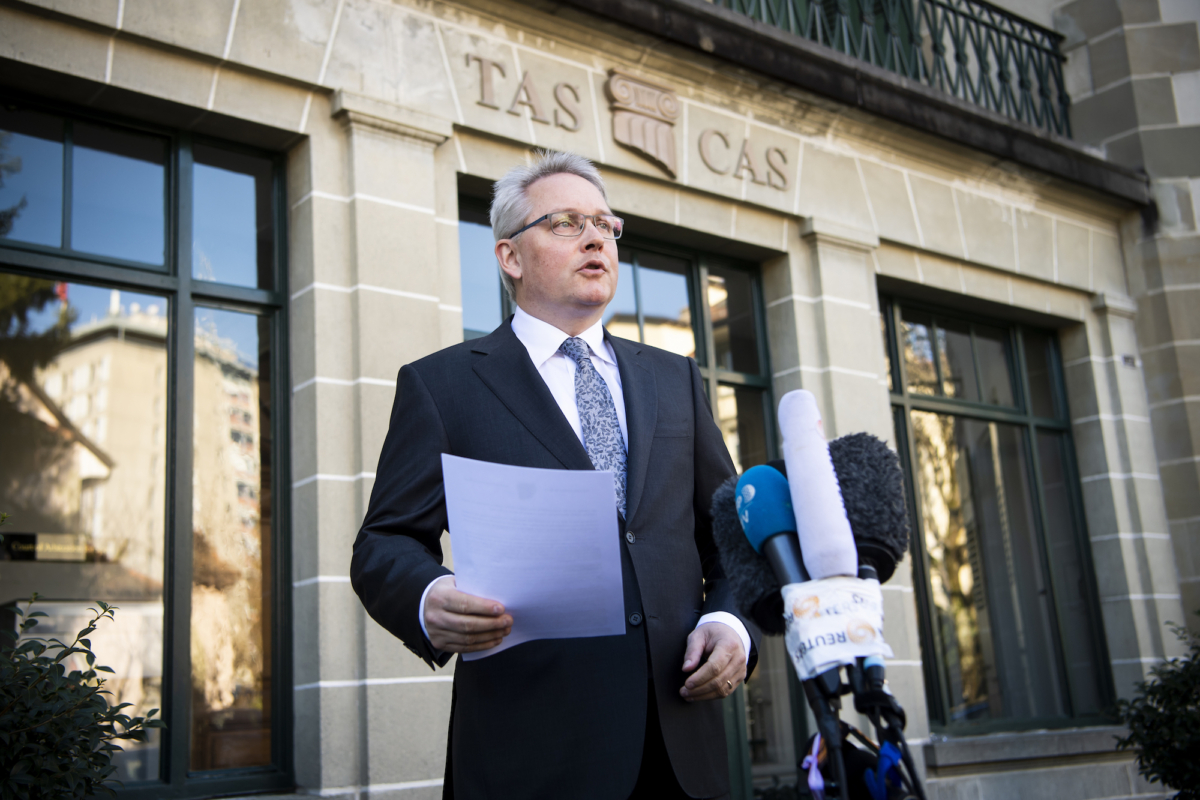 Matthieu Reeb, General Secretary of the Court of Arbitration for Sport, CAS, speaks to journalists during a statement as he announces the decision taken in the arbitration procedure of the case of Chinese swimmer Sun Yang in front of the Court of Arbitration for Sport (CAS) in Lausanne, Switzerland, on Feb. 28, 2020. (Jean-Christophe Bott/Keystone via AP)