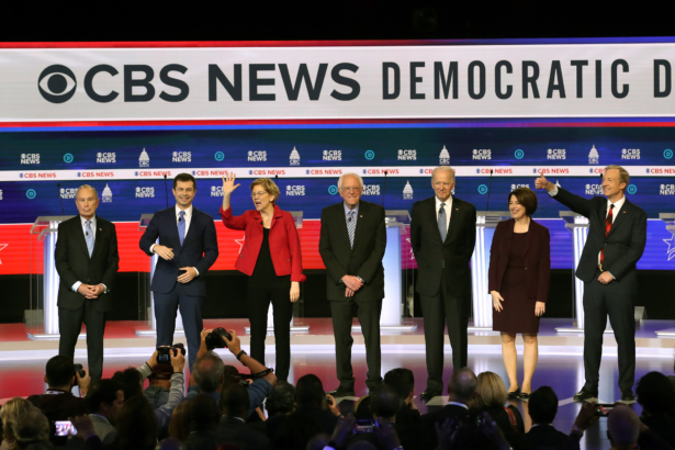 Democratic presidential candidates (L-R) former New York City Mayor Mike Bloomberg, former South Bend Mayor Pete Buttigieg, Sen. Elizabeth Warren (D-Mass.), Sen. Bernie Sanders (I-Vt.), former Vice President Joe Biden, Sen. Amy Klobuchar (D-Minn.), and Tom Steyer walk on stage prior to the Democratic presidential primary debate at the Charleston Gaillard Center in Charleston, S.C., on Feb. 25, 2020. (Win McNamee/Getty Images)