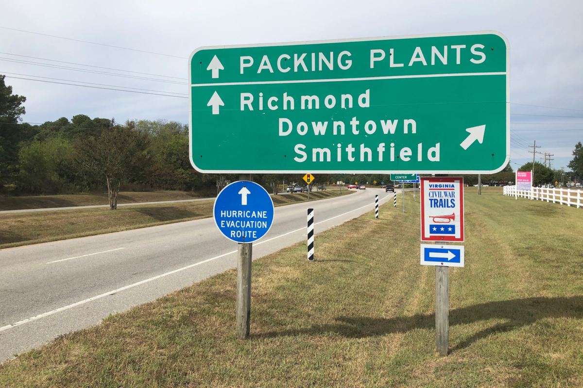 A road sign directs traffic to Smithfield Foods's pork processing