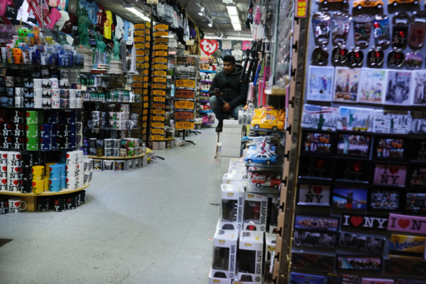A worker sits in an empty gift shop in New York City’s Chinatown on Feb. 13, 2020. The Department of Small Business Services in New York reported at the time that revenues were already down by 40 percent in Chinatown due to CCP virus concerns. (Spencer Platt/Getty Images)