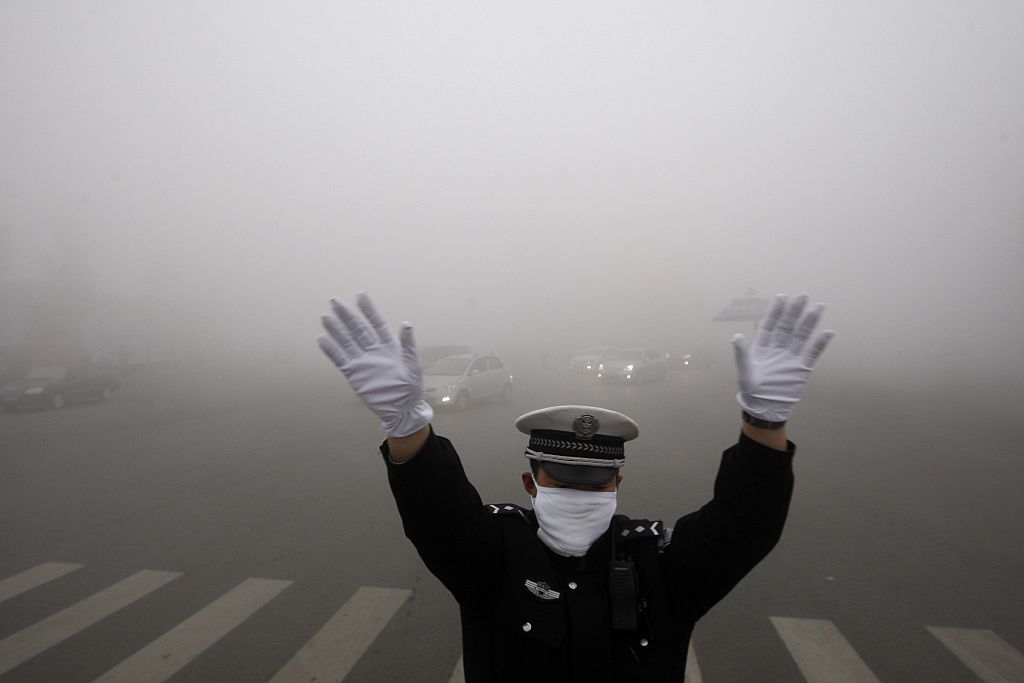 A policeman gestures