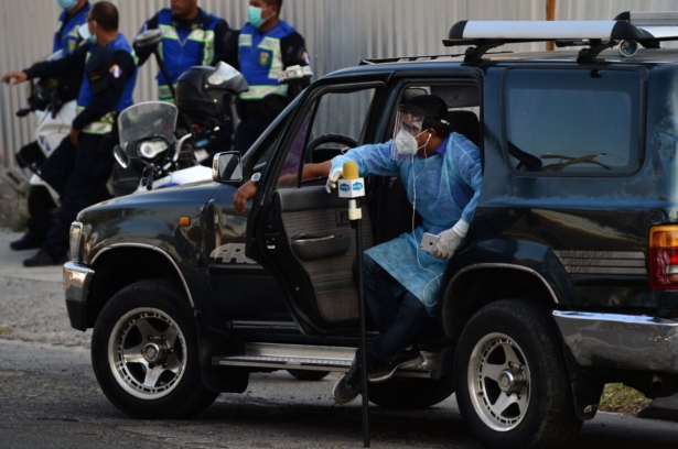 A journalist wears a protective outfit 