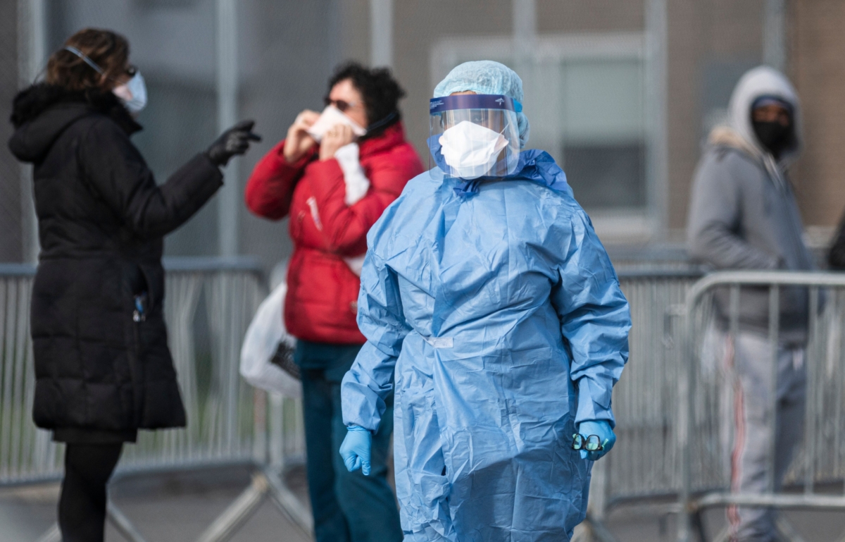 A medical worker at the NYC Health Hospital is seen in front of the COVID-19 testing site in Queens, New York City on April 22, 2020. (Johannes Eisele/AFP via Getty Images)