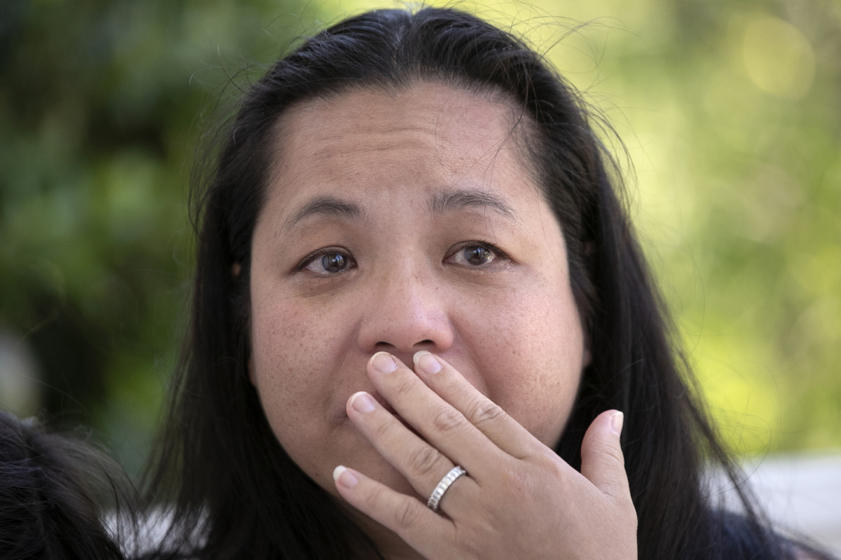 Jennifer Daly sits on her front porch as she recounts the ordeal of almost losing her daughter 12-year-old daughter Juliet to the CCP virus, in Covington, La., on April 30, 2020 (Gerald Herbert/AP Photo)