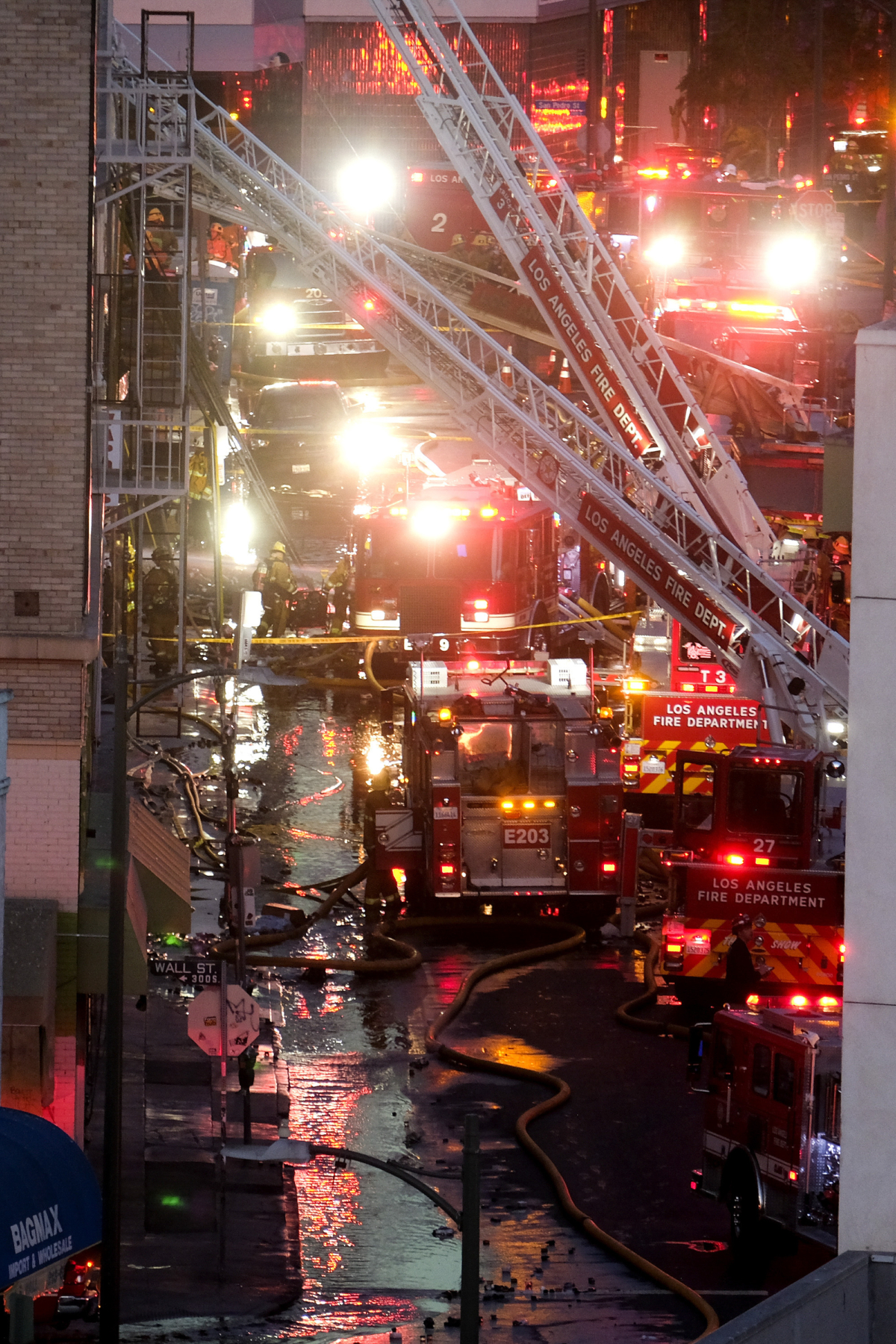 Los Angeles Fire Department firefighters work the scene of a structure fire that injured multiple firefighters, in Los Angeles, Calif., on May 16, 2020. (Ringo H.W. Chiu/AP Photo)