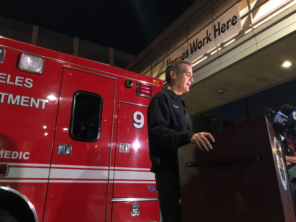 Los Angeles Mayor Eric Garcetti, standing next to Engine 9, updates the media on the conditions of multiple Los Angeles Fire Department firefighters who were injured in an explosion, in Los Angeles, Calif., on May 16, 2020. (Stefanie Dazio/AP Photo)