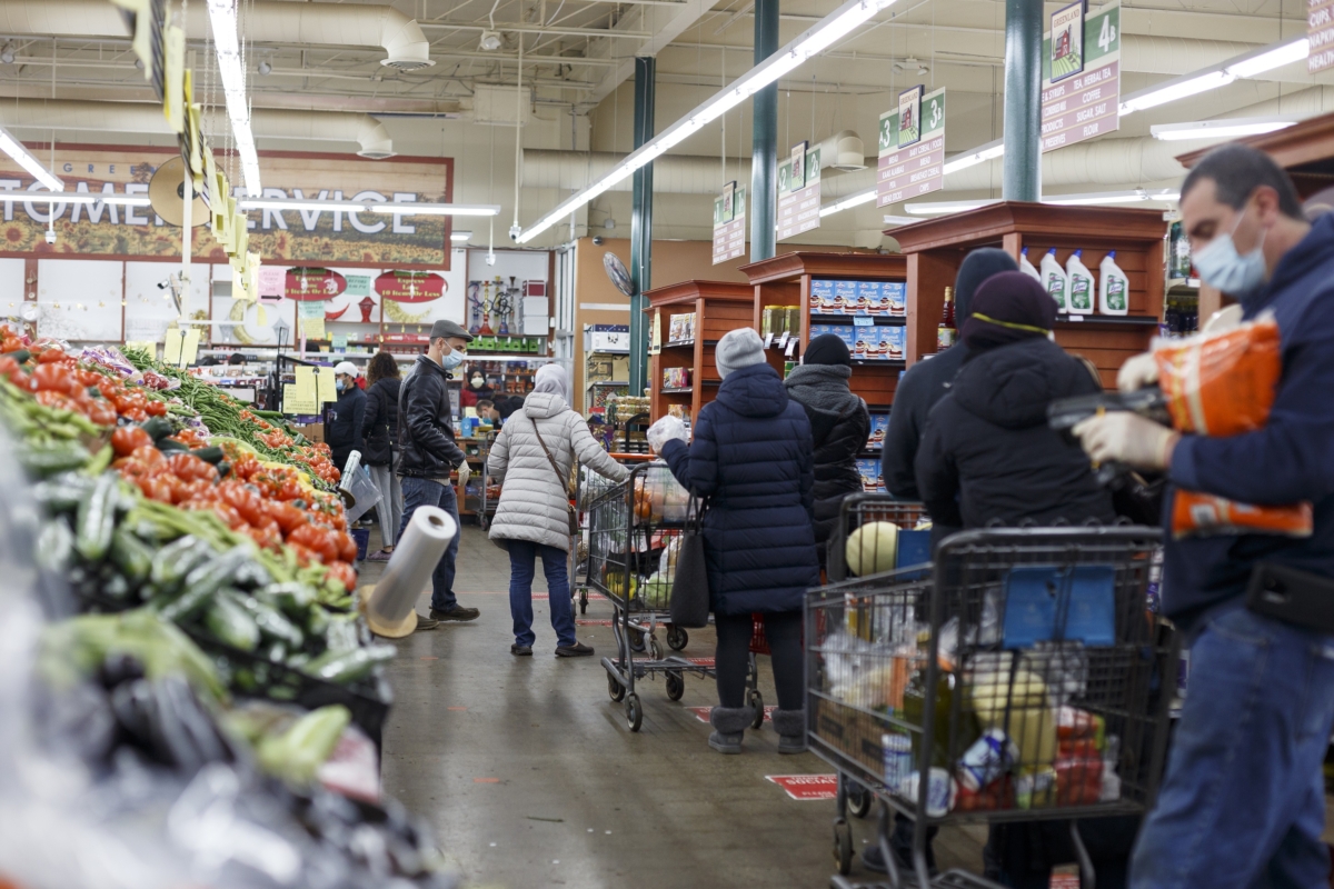 People line up to check out at Greenland Market on the first day of Ramadan in Dearborn, Mich., on April 23, 2020. (Elaine Cromie/Getty Images)