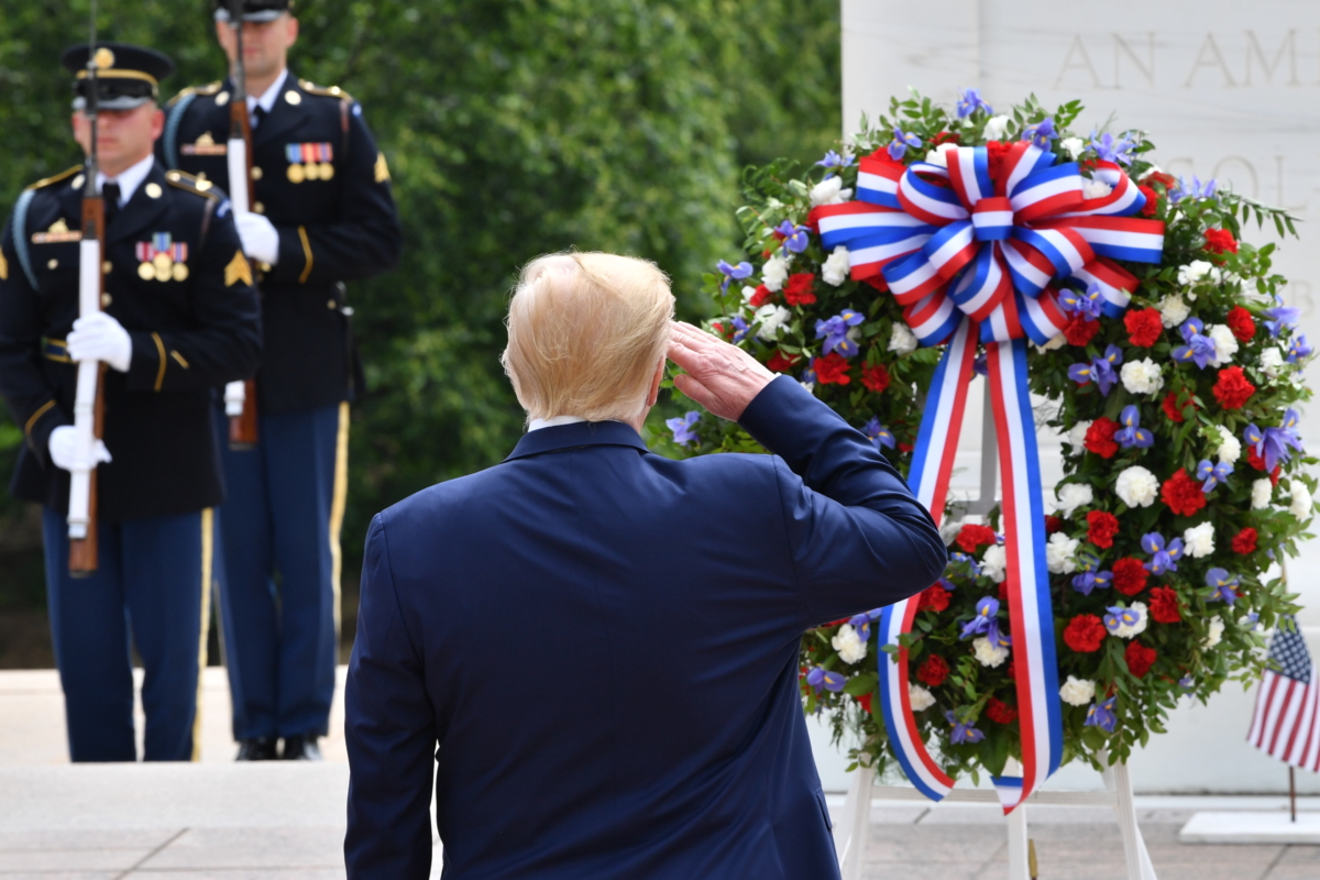 President Donald Trump salutes as he participates in a Wreath Laying Ceremony at the Tomb of the Unknown Soldier at Arlington National Cemetery to commemorate Memorial Day in Arlington, Va., on May 25, 2020. (Nicholas Kamm/AFP via Getty Images)