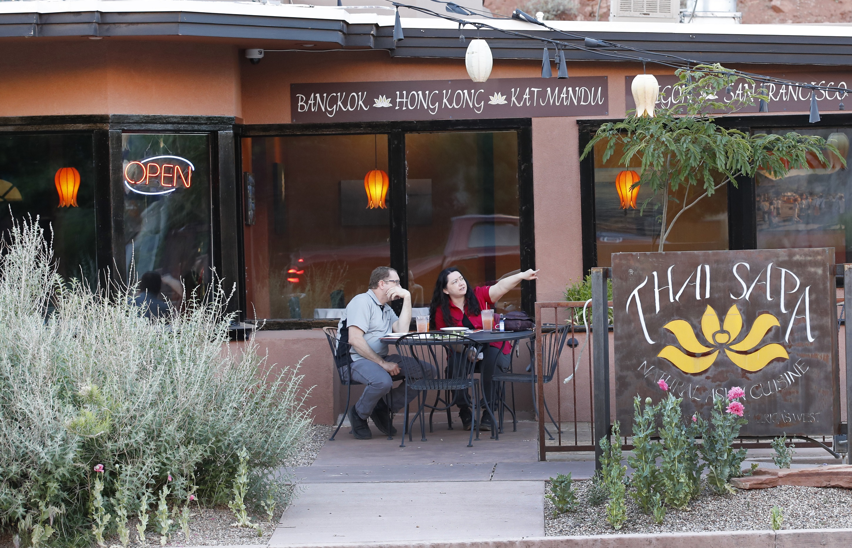 Two diners sit outside the Thai Sapa restaurant in Springdale, Utah on May 14, 2020. (George Frey/Getty Images)
