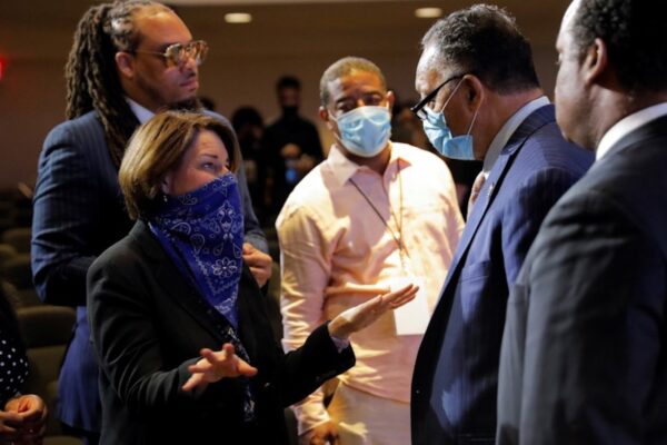Senator Amy Klobuchar talks with civil rights activist Reverend Jesse Jackson during a memorial service for George Floyd in Minneapolis, on June 4, 2020. (Lucas Jackson/Reuters)