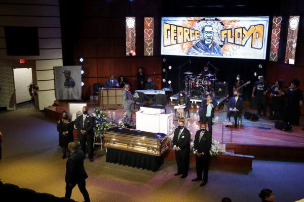 Guests gather at North Central University before a memorial service for George Floyd in Minneapolis, on June 4, 2020. (AP Photo/Julio Cortez)