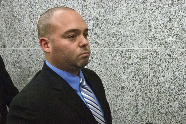 New York City police officer David Afanador leaves state court in New York following his arraignment, on Nov. 5, 2014. (Bebeto Matthews/AP Photo)