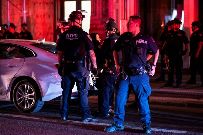 NYPD officers detains a protester for being involved in a looting of a store after marching against the death in Minneapolis police custody of George Floyd, in the Manhattan borough of New York City, N.Y., on June 2, 2020. (Eduardo Munoz/Reuters)