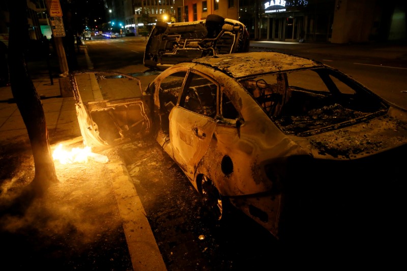 Destroyed vehicles are seen amid nationwide unrest