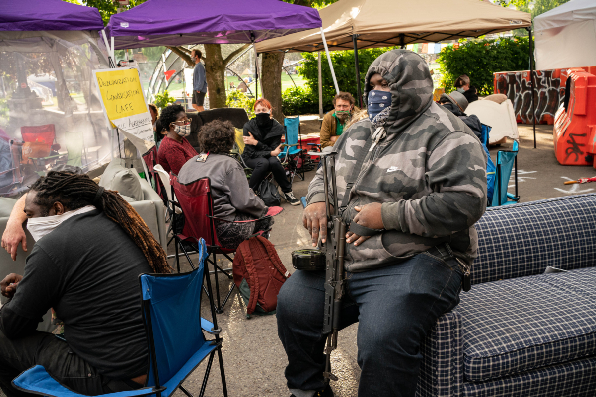 A man sits in an area inside the so-called autonomous zone in Seattle, Wash. on June 15, 2020. (David Ryder/Getty Images)