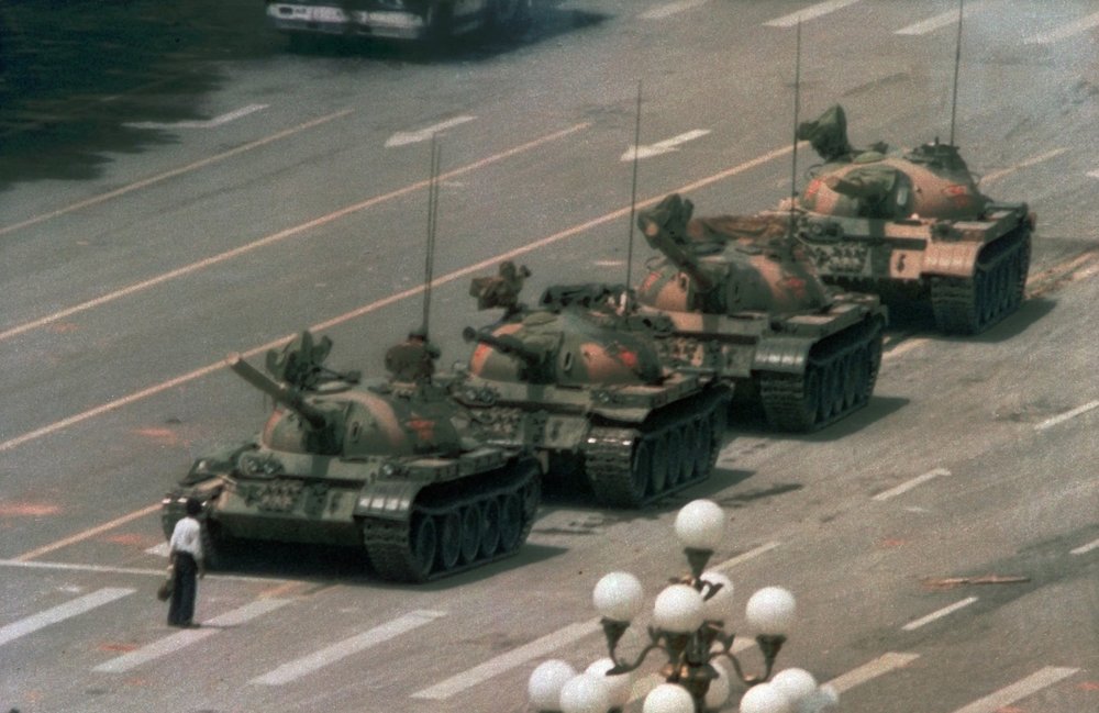 A Chinese man stands alone to block a line of tanks heading east on Beijing's Changan Blvd on June 5, 1989. (Jeff Widener/AP Photo)