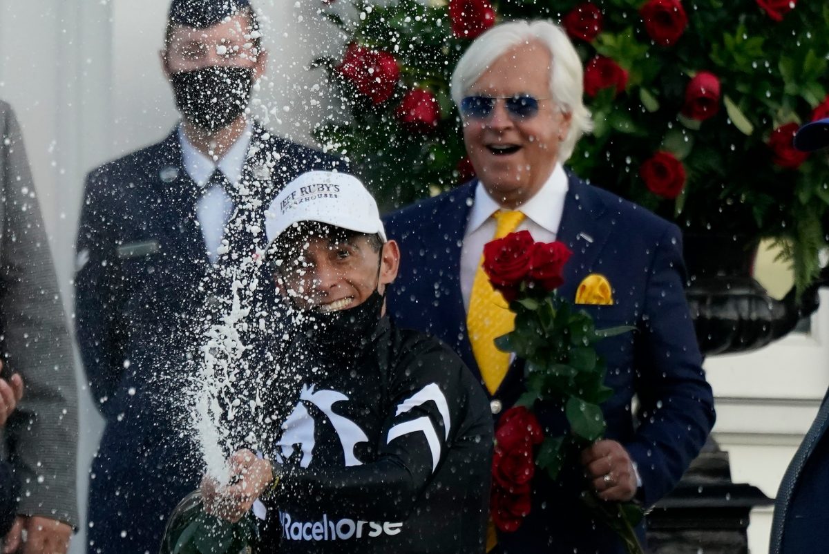 John Velazquez celebrates after riding Authentic to victory in the 146th running of the Kentucky Derby at Churchill Downs, in Louisville, Ky., on Sept. 5, 2020. (Jeff Roberson/AP Photo)