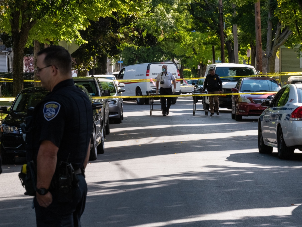 Police officers investigate a crime scene after a shooting at a backyard party in Rochester, N.Y., on Sept. 19, 2020. (Joshua Rashaad McFadden/Getty Images)