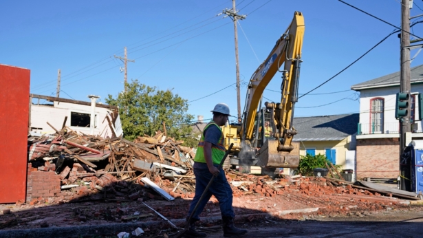 Workers remove debris from an unoccupied structure that collapsed as Hurricane Zeta passed through in New Orleans, on Oct. 29, 2020. (Gerald Herbert/AP Photo)