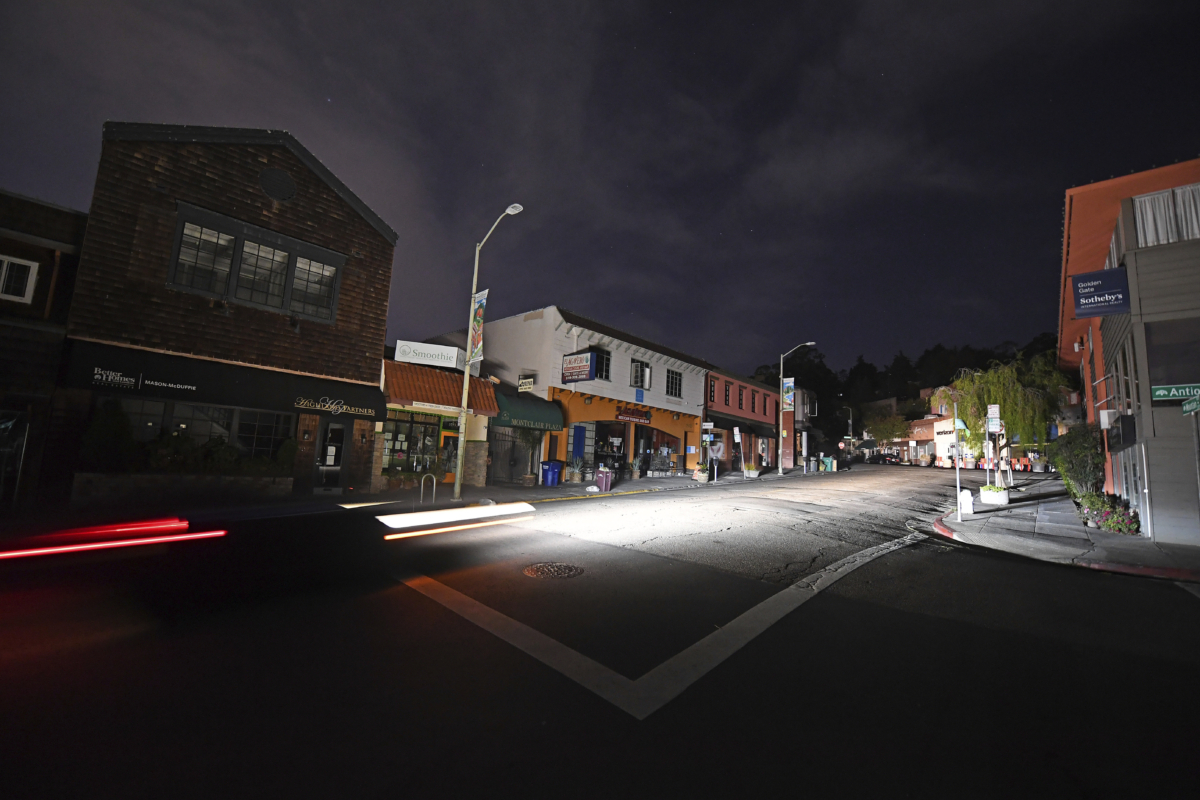 A vehicle drives up Mountain Blvd. in the Montclair neighborhood after the power has been shut off in Oakland, Calif., on Oct. 25, 2020. (Jose Carlos Fajardo/Bay Area News Group via AP)
