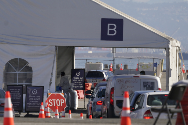 Vehicles line up at a COVID-19 testing site in San Francisco, Calif., on Nov. 16, 2020. (Jeff Chiu/AP Photo)