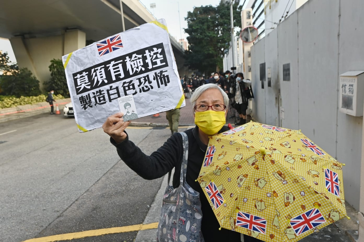 Hong Kong activist Alexandra Wong voices support for fellow activists outside of the West Kowloon Magistrates Court in Hong Kong on Dec. 2, 2020. (Song Bilung/The Epoch Times)