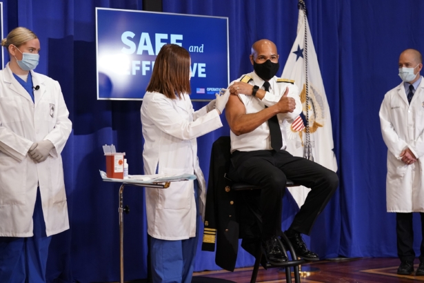 Surgeon General Jerome Adams receives a Pfizer-BioNTech COVID-19 vaccine shot at the Eisenhower Executive Office Building on the White House complex in Washington, on Dec. 18, 2020. (Andrew Harnik/AP Photo)