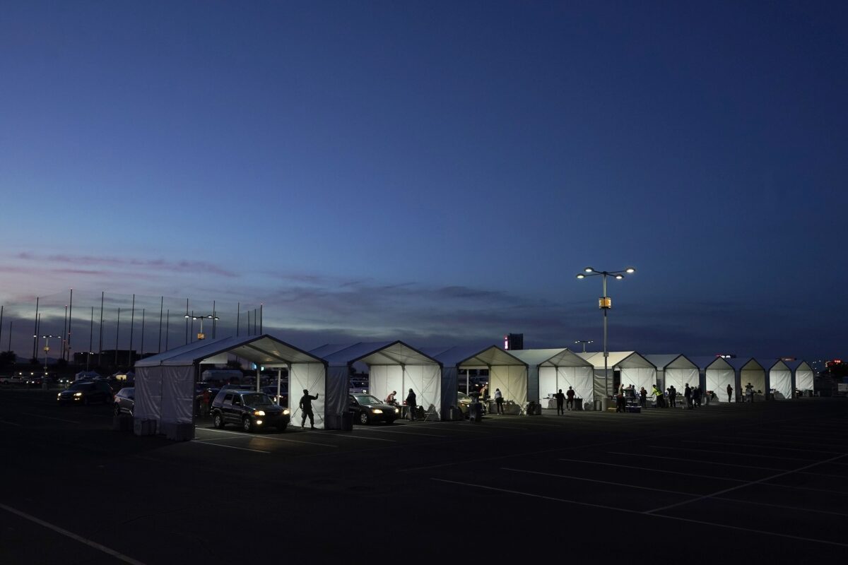 Several tents are set up for drive-thru COVID-19 vaccinations at the parking lot of the State Farm Stadium in Glendale, Ariz., on Jan. 12, 2021. (Ross D. Franklin/AP Photo)