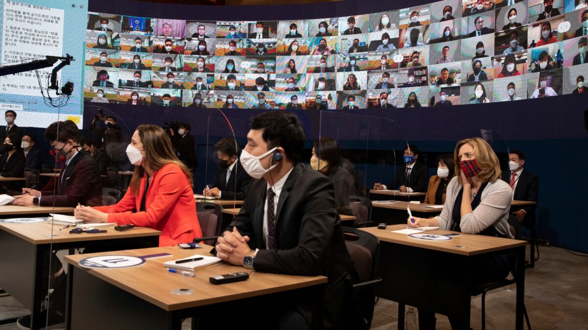 Journalists attend an online New Year press conference by South Korean President Moon Jae-in at the Presidential Blue House in Seoul, South Korea, on Jan. 18, 2021. (Jeon Heon-kyun/Pool Photo via AP)
