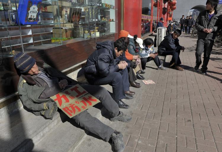 Migrant workers look for job opportunities along a roadside in Shenyang, Liaoning Province, China. (China Photos/Getty Images)
