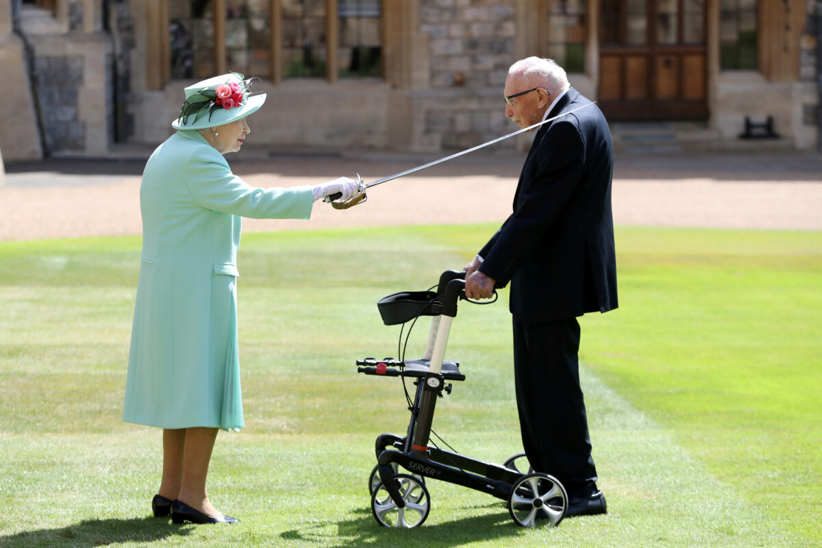 Britain's Queen Elizabeth awards Captain Tom Moore with the insignia of Knight Bachelor at Windsor Castle, in Windsor, Britain, on July 17, 2020. (Chris Jackson/Pool via Reuters)