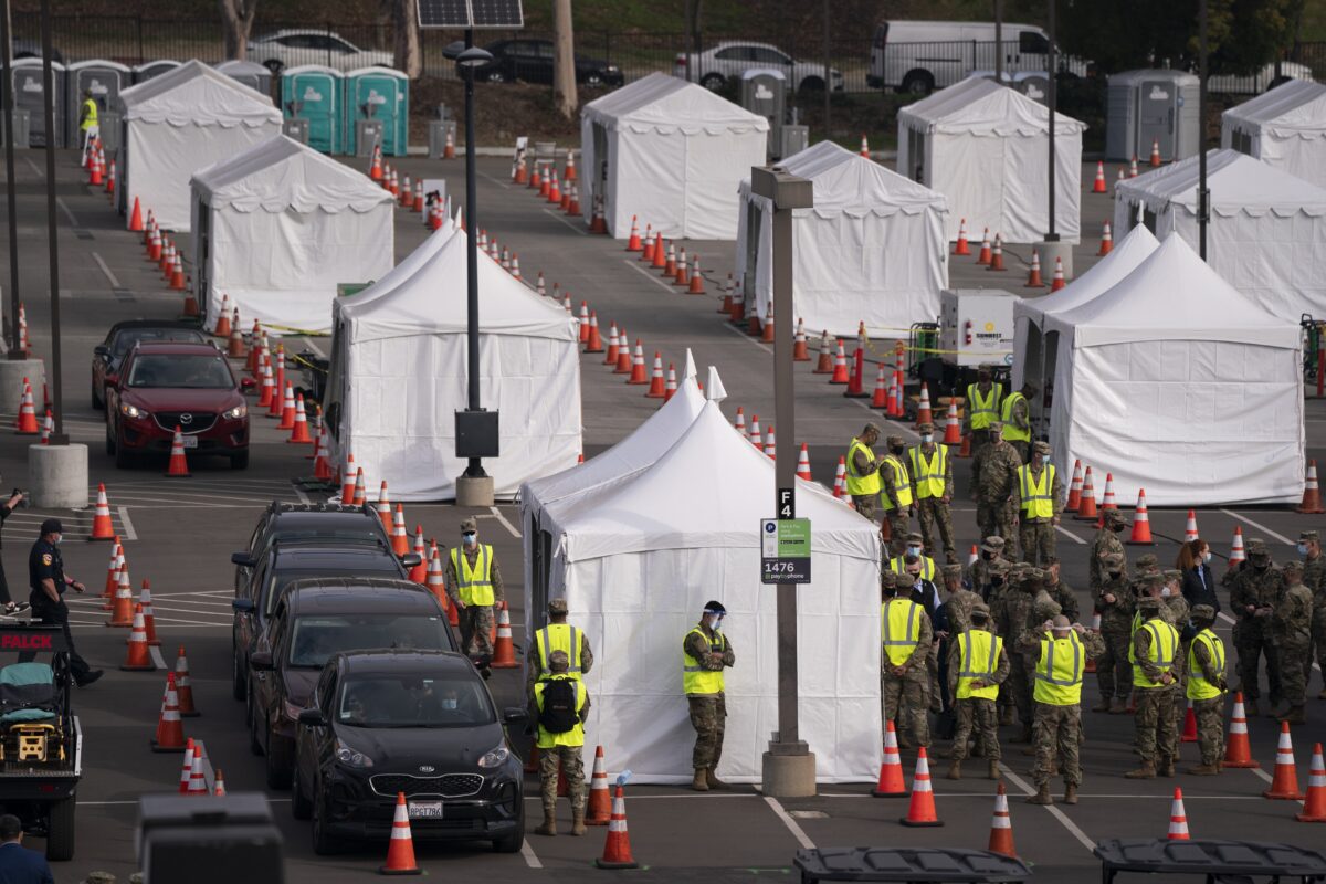 Motorists wait to get their COVID-19 vaccine at a federally-run vaccination site set up on the campus of the California State University of Los Angeles in La., on Feb. 16, 2021. (Jae C. Hong/AP Photo)