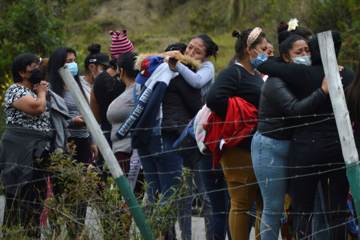 Prisoners' relatives gather outside Turi jail where an inmate riot broke out in Cuenca, Ecuador, on Feb. 23, 2021. (Boris Romoleroux/API via AP)