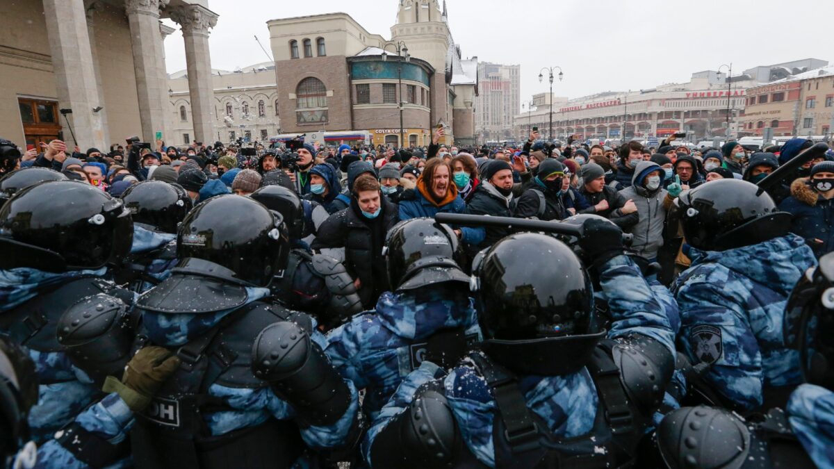 People clash with police during a protest 