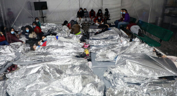 Family units and unaccompanied alien children are held in a temporary processing facility in Donna, Texas, after being apprehended by Border Patrol. (CBP)