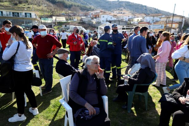 Local residents gather at a soccer field 