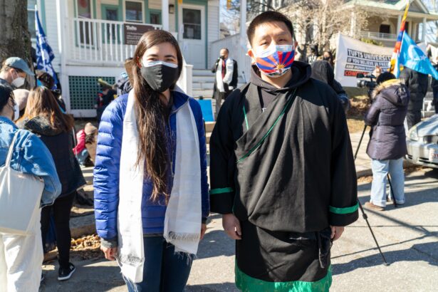 Massachusetts Representative Erika Uyterhoeven (Democrat, left) and protest organizer Olo Bayul urge Tufts University to close its Confucius Institute in Somerville, Massachusetts on March 13, 2021. (Learner Liu/The Epoch Times)